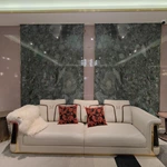 Cream Leather Sofa with Dark High-Gloss Wood Panels, Monogram Cushions and Metal Base Trim